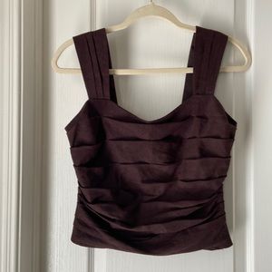 Express, small, brown, thick straps, cropped, linen top. Lined, zipper on side.